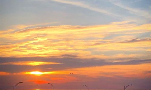 Sun setting over Lake Michigan from rooftop patio